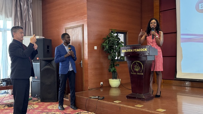 A person and person standing on a podium