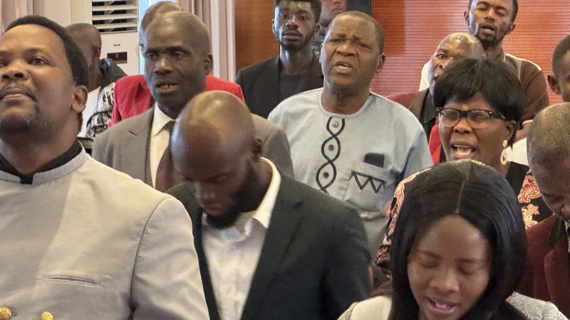 A group of people standing in a room