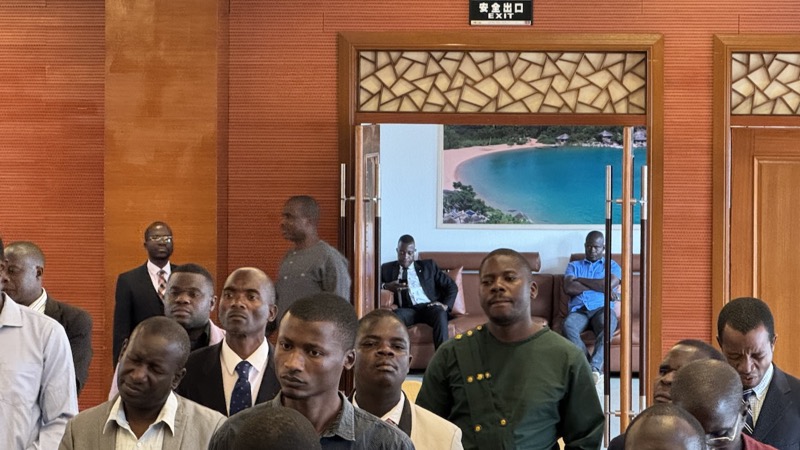 A group of people standing in a room