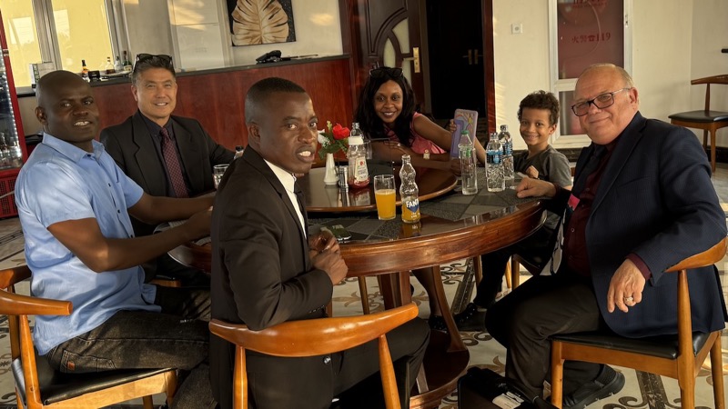 A group of people sitting around a table