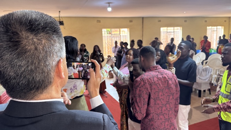 A person taking a picture of a group of people