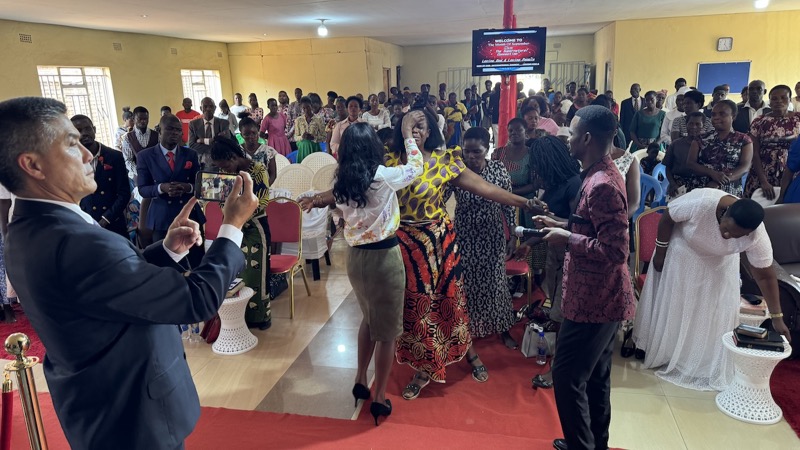 A group of people dancing in a room