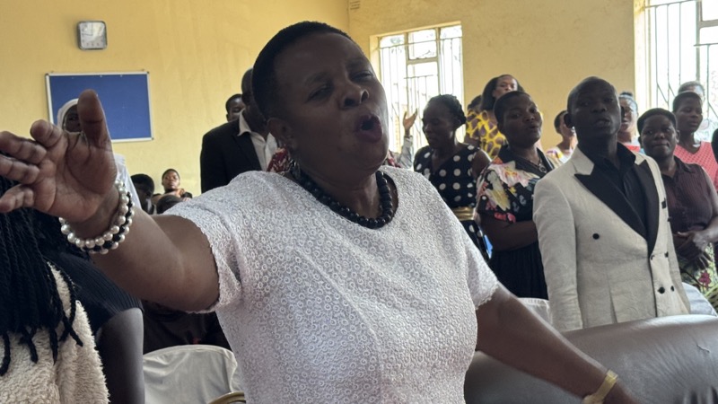 A person singing in a room