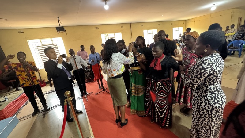 A group of people standing in a room
