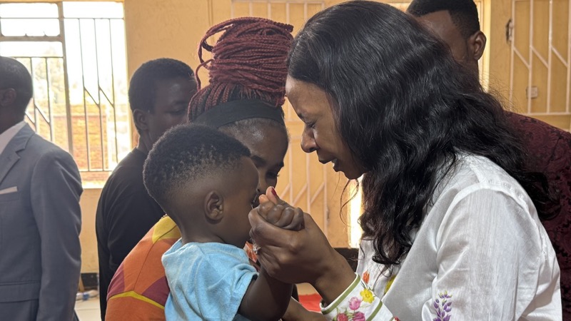 A person praying with a child