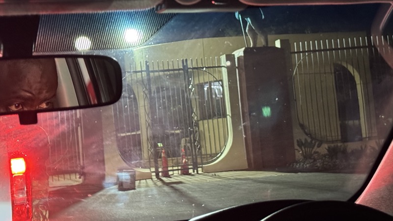 A car with a gate and a door with medium confidence