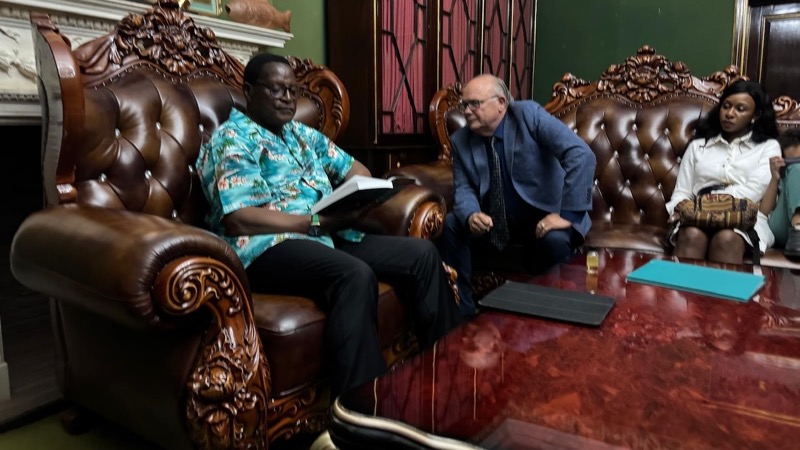 A person sitting in a chair next to a person
