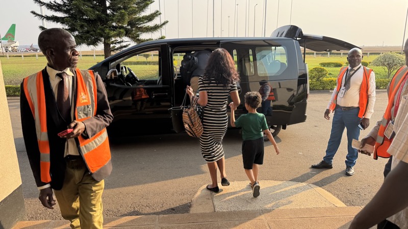 A group of people walking into a van