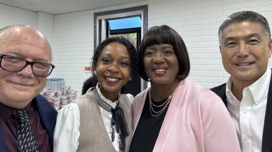Two women smiling at the camera
