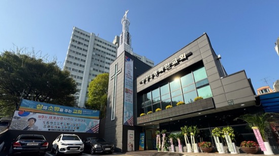 A building with a cross on the top