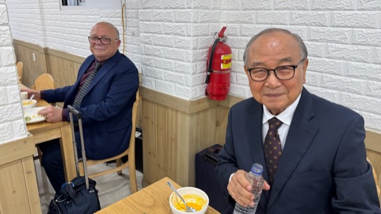 Two men sitting at a table