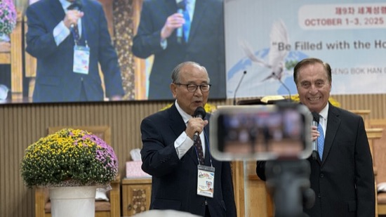 A person speaking into a microphone