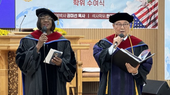 A person and person in graduation gowns and cap and gowns