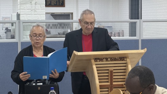 A person and person standing at a podium