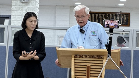 A person standing at a podium
