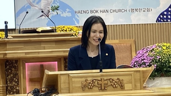 A person sitting at a podium