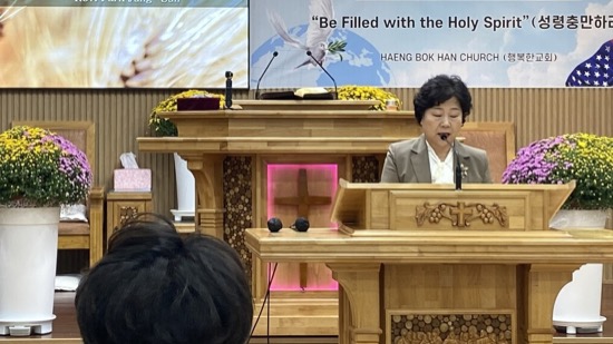A person speaking at a podium