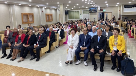 A group of people sitting in a room