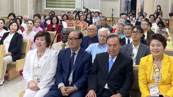 A group of people sitting in chairs