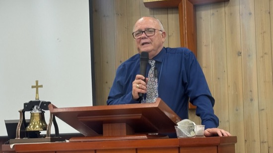 A person speaking into a microphone