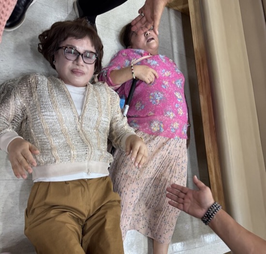 A person lying on the floor with a child