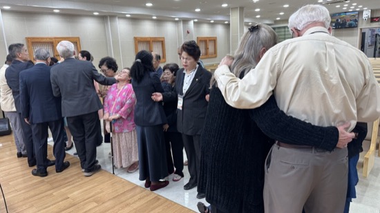 A group of people standing in a room