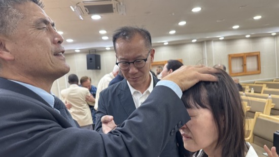 A person touching a person's head