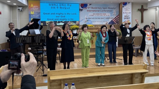 A group of people standing on a stage
