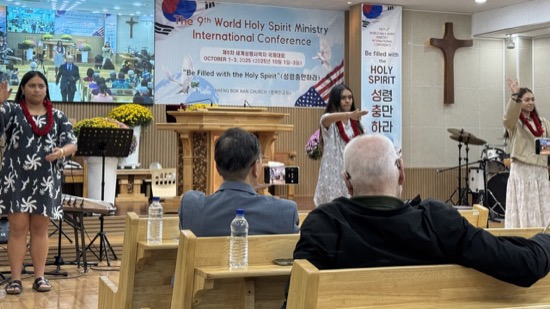 A person standing in front of a group of people