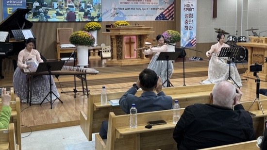 A group of people sitting in a room