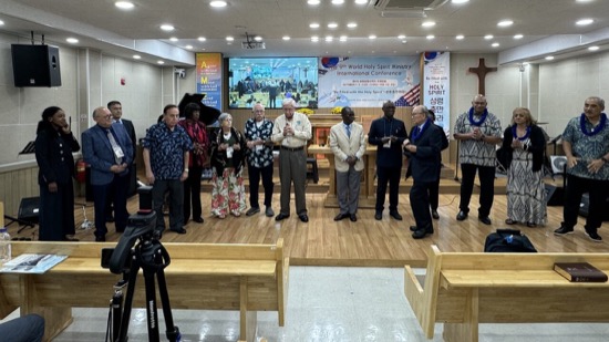 A group of people standing in a room
