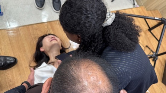 A person looking at a person's head