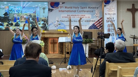 A group of women in a blue dress