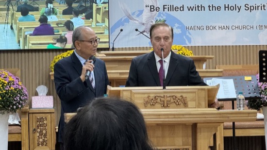 A group of men standing at a podium