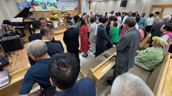 A group of people standing in a room