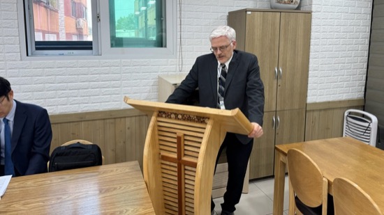 A person standing behind a podium