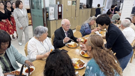 A group of people eating at a table