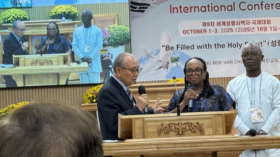 A person and person talking at a podium