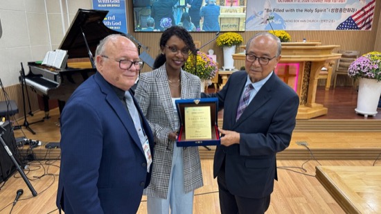 A group of people holding a certificate