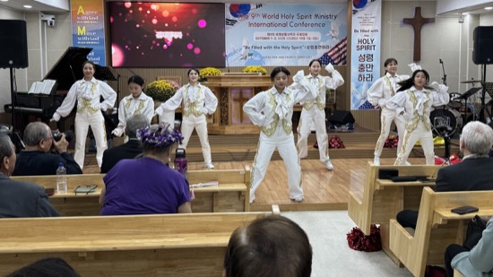 A group of people performing on a stage