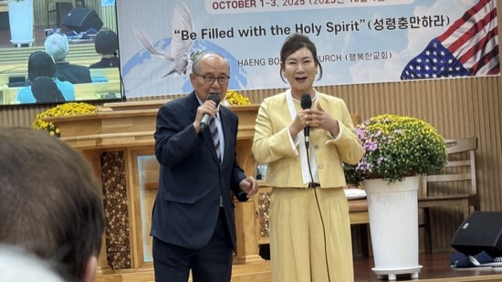 A person and person holding microphones