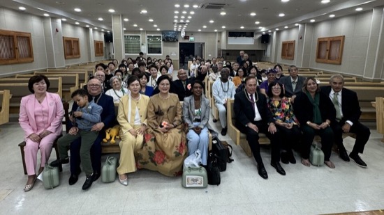 A group of people sitting in a room