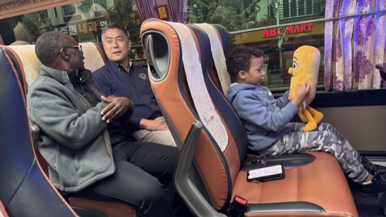 A group of people sitting in a bus
