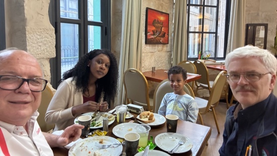 A person and a child sitting at a table