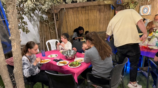 A group of people sitting at a table