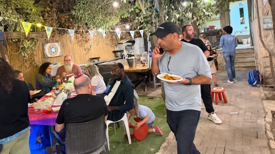 A person holding a plate of food