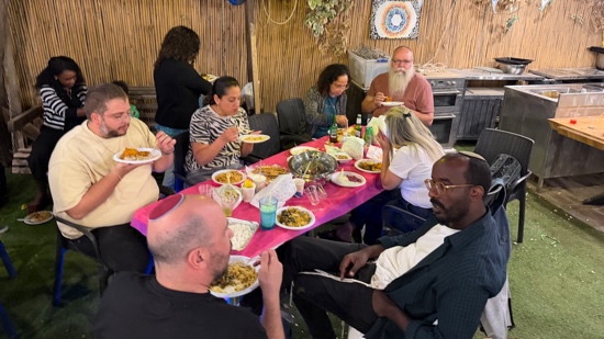 A group of people eating at a table