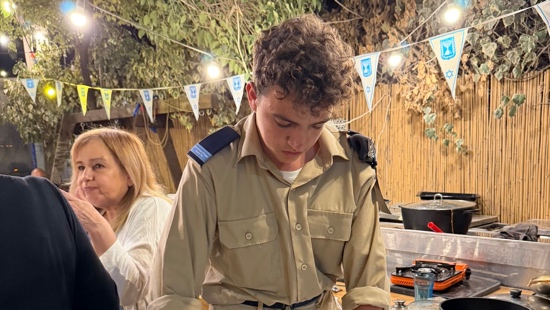 A person in uniform looking down at something