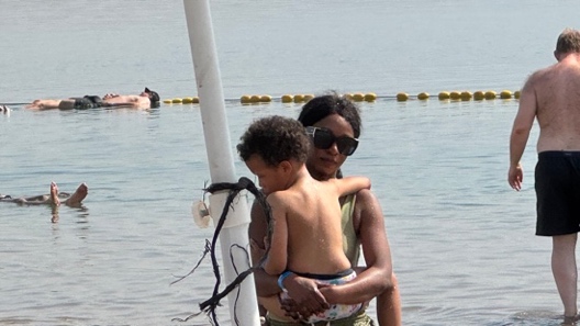 A person holding a child in her arms