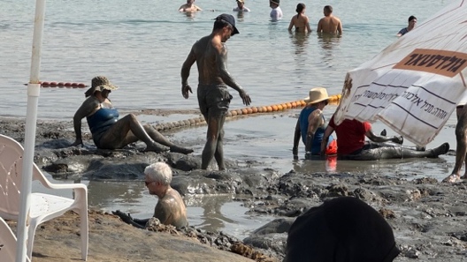 A group of people in a muddy area